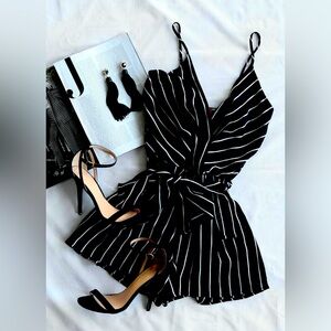 Full outfit. New. Black and white dress with dangling earrings and black heals